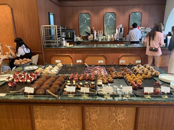 A bakery display case filled with various pastries.