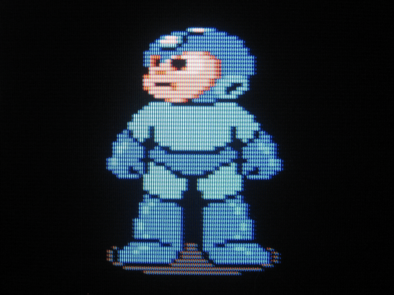 Mega Man is victorious, he looks wistfully up and to his right, reflecting, perhaps, on his tribulations, and, dare I say, the future..?