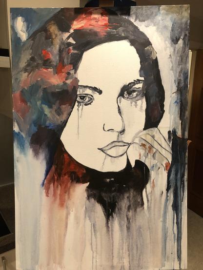 A painting depicting a contemplative woman with long, dark hair. She has tear streaks on her cheeks and is resting her chin on her hand. The background features a blend of vibrant colors, including reds and blues, creating an emotional atmosphere.