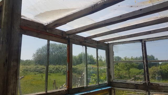 Glasshouse roof, 'plastic house ' doesn't sound good.