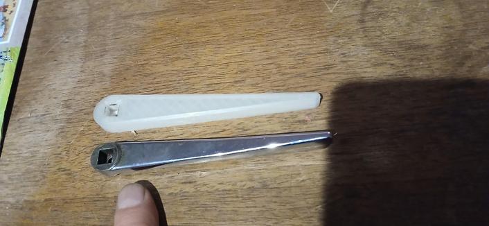 Top closing lever in cast stainless steel and another in tan PLA