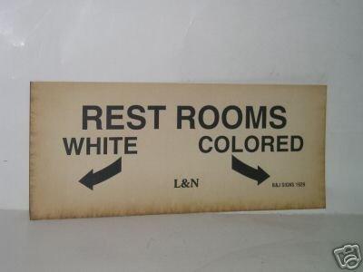 A sign from the US Segregation era for a bathroom, separate facilities for Blacks and Whites.