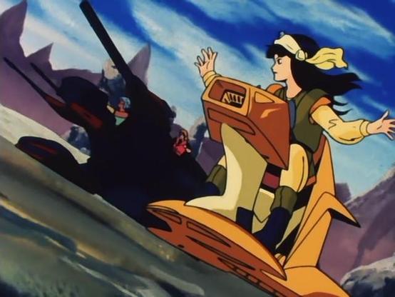 a image from he show, it is of an exotic space-tank flying vehicle with several long forward-pointing cannons on it next to a girl on a hover-motorcycle, she is letting go of the handles, a scarf tied around her head, she is wearing earth - toned garments, a blue sky with clouds over the desert landscape