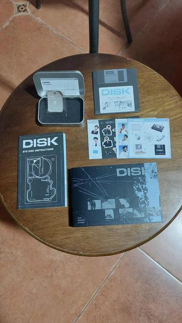 Also inside the BTS 7 Moments box is a folded instruction booklet, and a photo book. Also shown are the QR code keyring and the sticker sets.