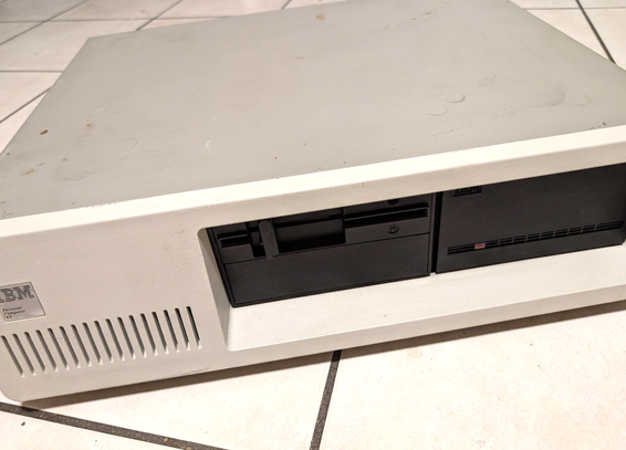 Exterior of an IBM 5160 desktop, with a half height 5.25" drive and a full height hard drive