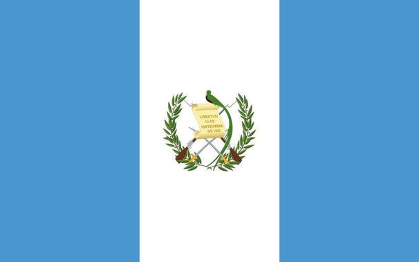 Flag of Guatemala with two light blue and one white stripe. In the center of the white stripe are  two guns and two swords crossed and a bird. There is a a piece of paper that says: "LIBERTAD 15 DE SEPTIEMBRE DE 1821" (Liberty, September 15, 1821).