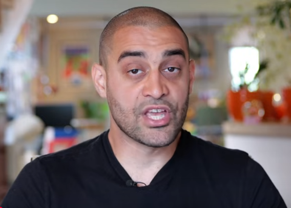 A shaven headed man of Palestinian heritage