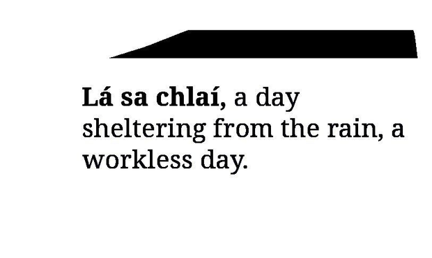 A picture saying: "Lá sa chlaí, a day sheltering from the rain, a workless day."