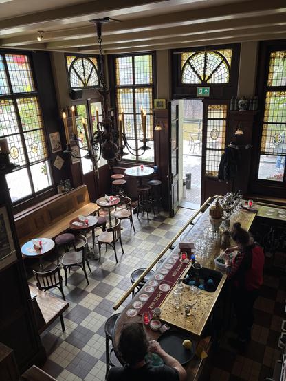 Largely brown interior of Cafe 't Smalle, seen from above.