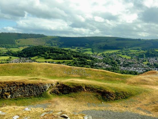 View of wider setting of message on higher of two tiers of defensive ramparts