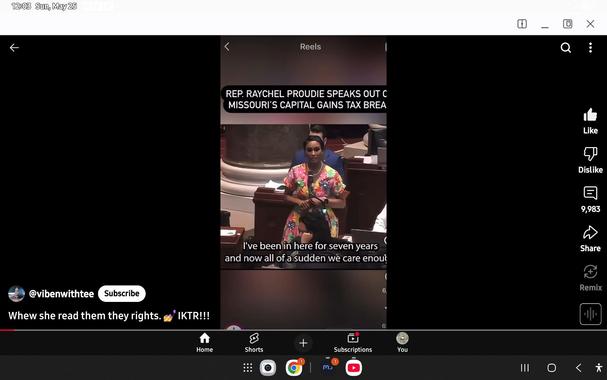 Black woman in floral dress speaking to Congress