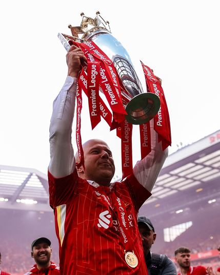 Arne Slot, lifting the Premier League trophy on his first attempt.