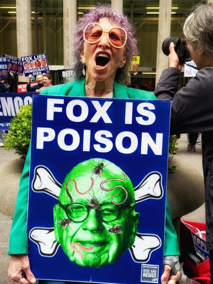 A woman protested at FOX Headquarters in NYC on May 24, 2025.