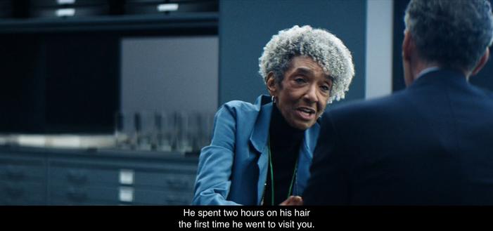 Felicia’s seated with Irving B. inside O & D. They’re talking about Burt G. and Felicia says, “He spent two hours on his hair the first time he went to visit you.”