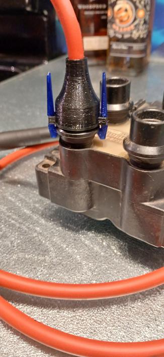 Closeup of printer boot showing retaining clips. They use the boot flexibility as the spring to keep them clamped.