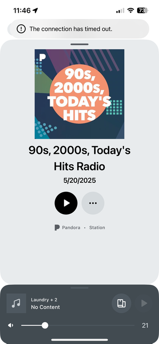 The image shows a mobile device screen displaying a radio station interface. At the top, the time is 11:46, and the battery is at 73%. A message indicates "The connection has timed out." Below this, there is a colorful album cover with the text "90s, 2000s, Today's Hits" in a large orange circle. The station name is "90s, 2000s, Today's Hits Radio," with the date "5/20/2025" underneath. There are two buttons: a black play button and a gray button with three dots. The station is identified as "Pandora Station." At the bottom, there is a music player interface with a title "Laundry + 2" and "No Content," a volume slider, and a progress bar indicating 21 seconds.