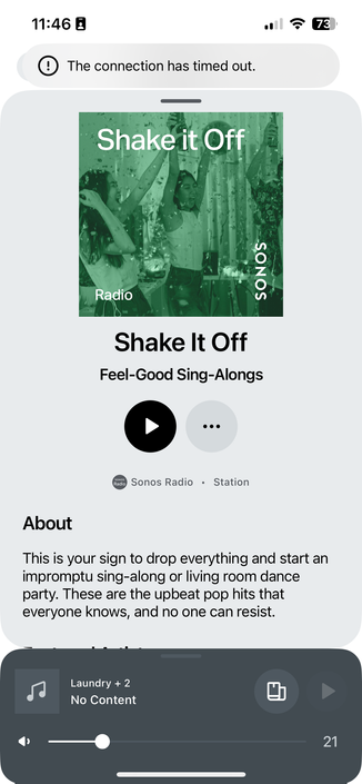The image shows a mobile device screen displaying a music streaming app interface. At the top, the status bar indicates the time as 11:46, with a battery level of 73%, and a Wi-Fi connection. Below the status bar, there is a message stating "The connection has timed out." The main content area features a radio station named "Shake It Off" under the category "Feel-Good Sing-Along." The album cover is green-toned, showing people celebrating with confetti. The station is labeled "Sonos Radio" and is categorized as a "Station." Below the album cover, there is a play button and a description that reads, "This is your sign to drop everything and start an impromptu sing-along or living room dance party. These are the upbeat pop hits that everyone knows, and no one can resist." At the bottom of the screen, there is a section labeled "Laundry + 2" with "No Content" and a progress bar indicating 21 seconds.