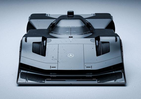 A sleek, futuristic race car with an aerodynamic design displayed against a gray background, showcasing matte black surfaces and details.