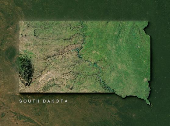 Satellite topographical map of South Dakota. The state outline is highlighted against a dark green background. The image shows South Dakota's distinct geographic division: the rugged Black Hills region appears as dark, mountainous terrain in the western portion, while the eastern half displays the greener, flatter Great Plains with visible agricultural patterns. The Missouri River runs north-south through the center of the state, creating a natural boundary between these two distinct regions. Several reservoirs appear as blue areas along the river system. The map effectively illustrates the dramatic contrast between the state's western badlands and eastern prairie landscapes.
