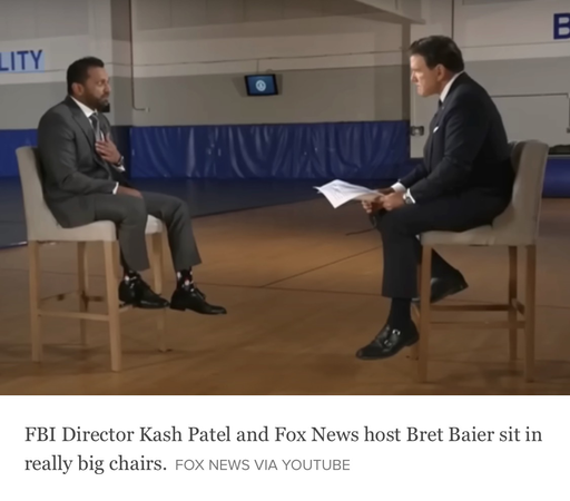 Screenshot from a FOX News interview of Kash Patel by Brett Baier. Both are sitting on unusually big chairs, but Kash Patel looks to be a child sitting on a chair for adults!