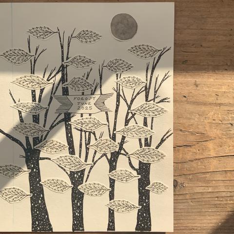 The illustration for the front cover of a zine showing trees with dark, lichen-speckled bark and covered in leaves.