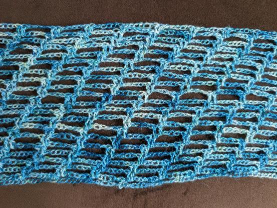 close-up of the blue/teal/white wrap (Malabrigo Silkpaca in Cantabrico)