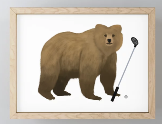 Our bear mascot is playing golf, shown on on a framed mini art print.