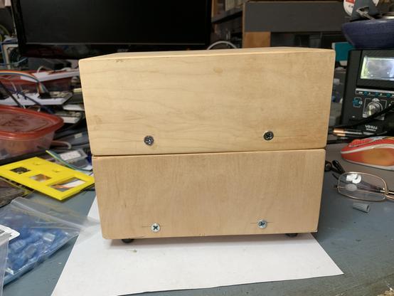 Sides of the two boxes showing they are pretty much the same size with screw locations in roughly the same location