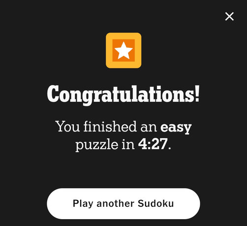 Completion screen for a Sudoku game, displaying the text "Congratulations! You finished an easy puzzle in 4:27. Play another Sudoku," and bearing a star icon.