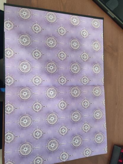 End paper light-purple color with a pattern of a decorated wind rose.