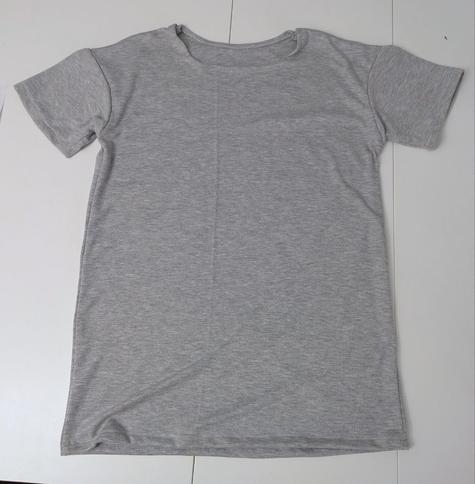 Mottled grey t-shirt laid flat on a table