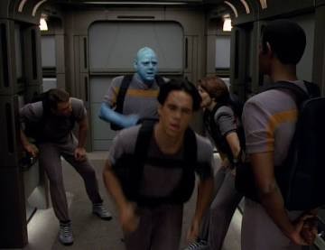 Maquis crew members doubled over from exhaustion with Tuvok looking on.