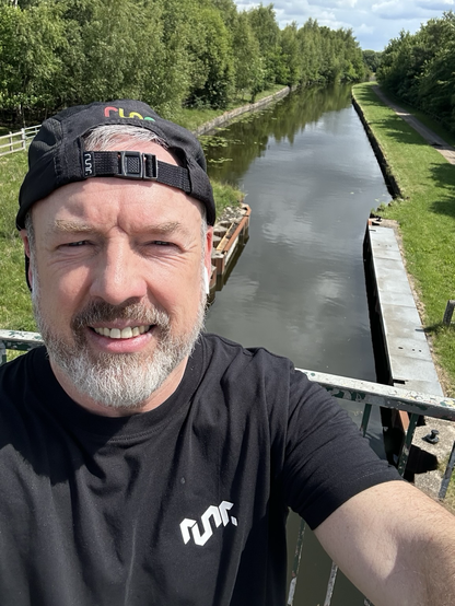 Man on bridge over canal