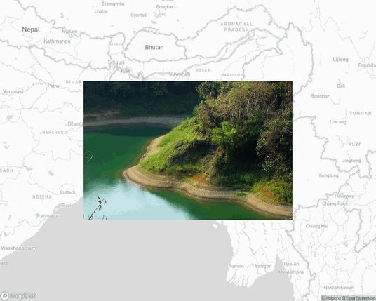 A photo of or from a national park from the linked website, overlaid on a cropped world map where it's located.