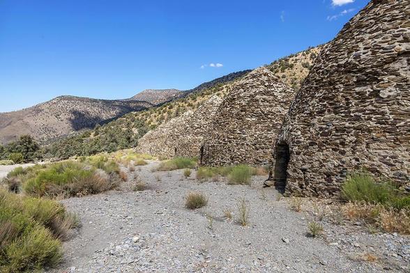 The Wildrose Charcoal Kilns in Death Valley, California, stand as a testament to the area's rich mining history, set against a striking desert and mountain backdrop.