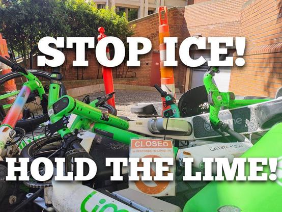 "STOP ICE
HOLD THE LINE"
A cheerful pile of bright green Lime bikes blocking a driveway into the Henry M Jackson Federal Building in Seattle