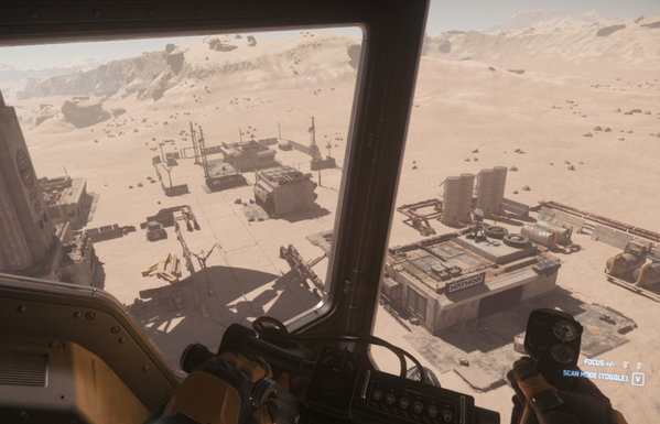 Star Citizen Screenshot: Ausblick aus dem Copiloten-Sitz einer Corsair über eine Basis in wüstenartigem Gelände. Der Sitz ist unter dem Piloten angeordnet und gibt einem einen guten Blick nach unten.