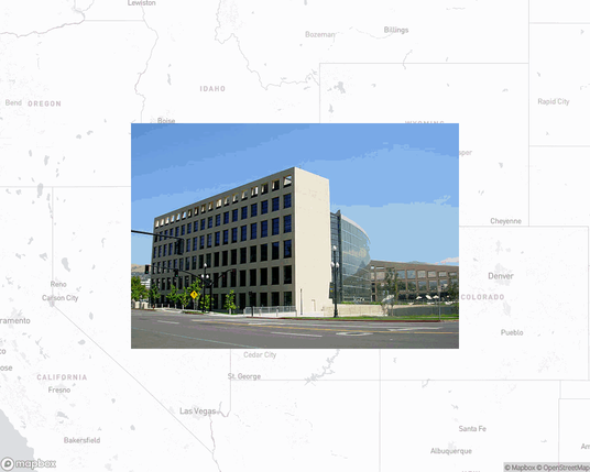 A photo of or from a library from the linked website, overlaid on a cropped world map where it's located.