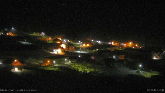 McMurdo Station, Antarctica, as seen in this NSF/United States Antarctic Program web camera image, is presently dark. Lights illuminate buildings and cast interesting shadows. McMurdo Station is approximately 800 miles north of the South Pole. (Then again, virtually everything is north of the South Pole, as many authors have noted!)