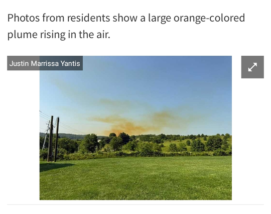 Large orange colored plume over a row
