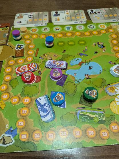 The main board of Come Together. There are hippie tokens "resting" near buses.