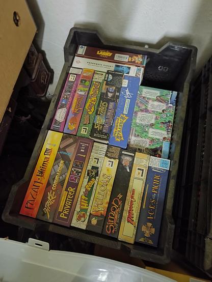 A box with old PC game boxes