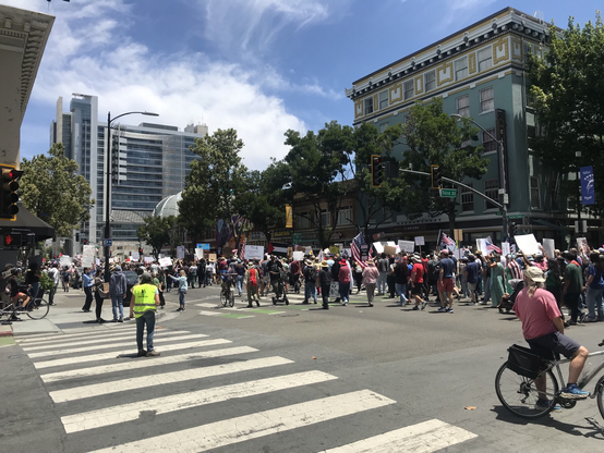 Marchers on Santa Clara Street in San Jose, CA marching to city hall