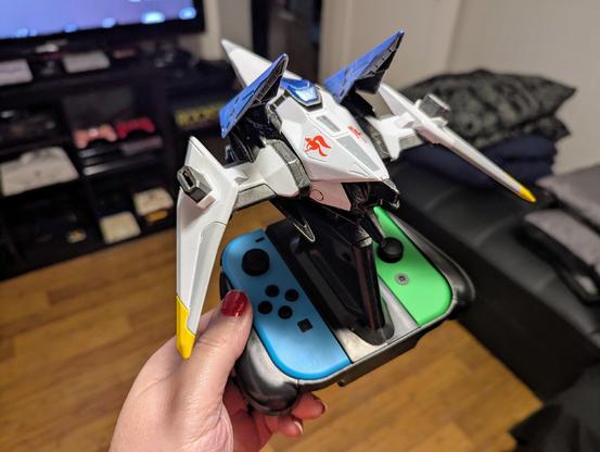 The Switch-exclusive Starlink Arwing figurine with the Joy-cons connected (in my hand)