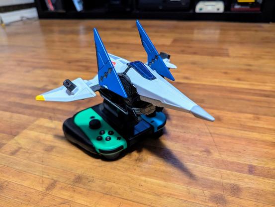 The Switch-exclusive Starlink Arwing figurine with the Joy-cons connected (on the floor for a better look)