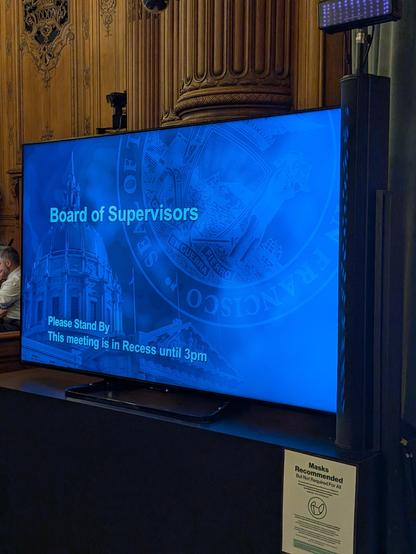 TV at board chamber announcing the recess.