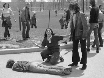 Mary Ann Vecchio gestures and screams as she kneels by the body of a student, Jeffrey Miller, lying face down on the campus of Kent State University, in Kent, Ohio in 1970.