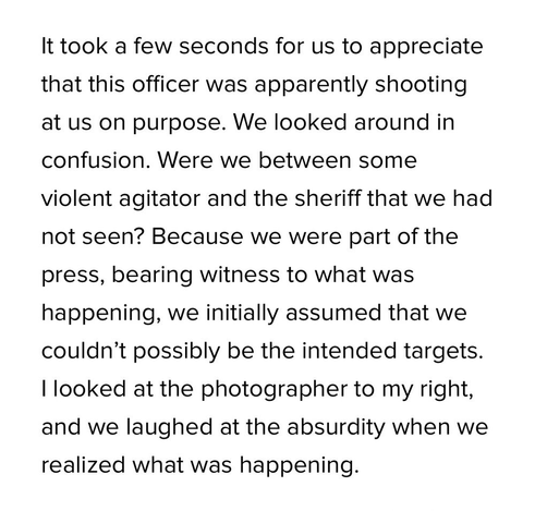 Text excerpt describing a confusing and tense situation involving a police officer shooting at a group, including members of the press. The group initially misunderstands the intent and reacts with disbelief.