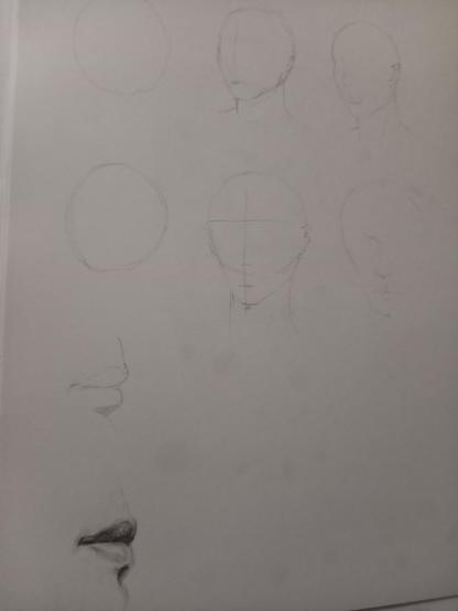 A series of pencil sketches including circles with the proportions for facial features and mouthed with shading to render a 3d aspect