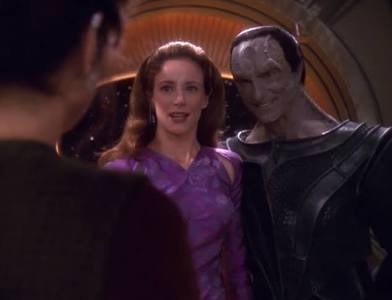 Dukat smiling and standing next to Kira’s mothet